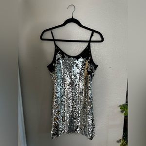 Mini sequin dress, black on one side, silver on the other.